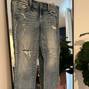 Light wash American Eagle Artist Jeans, lightly dirstressed